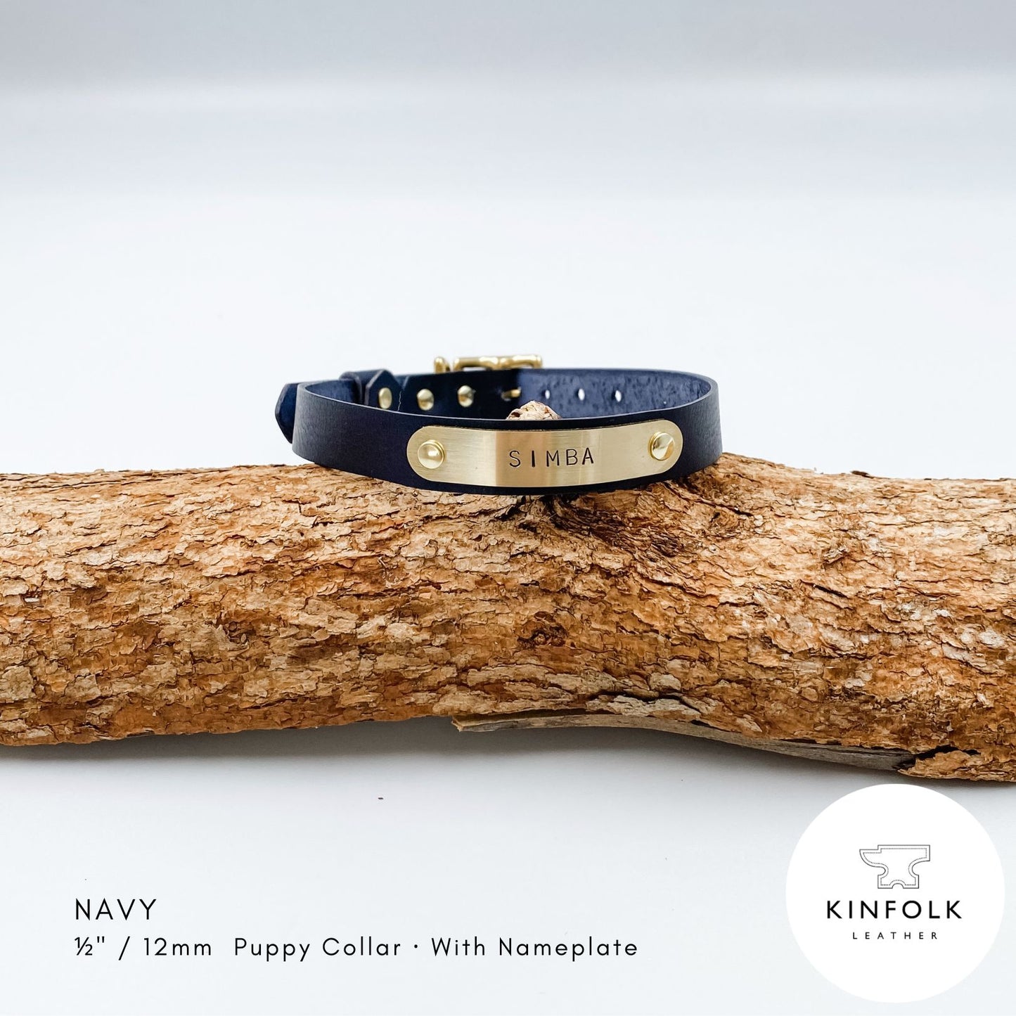Navy blue leather puppy collar with personalised brass nameplate